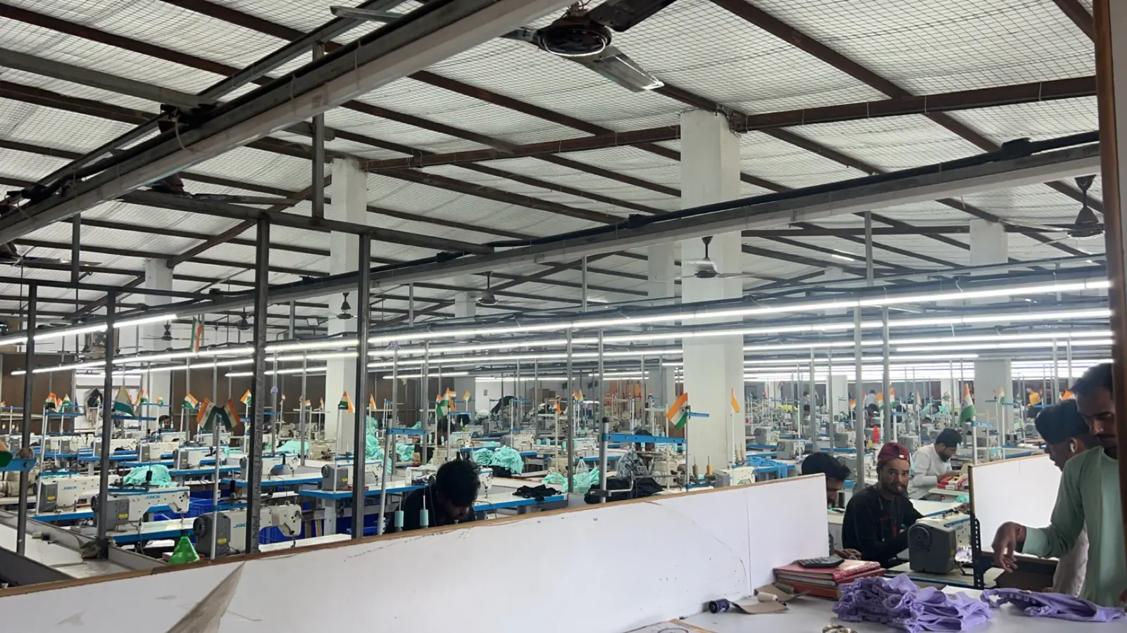 Production lines running on the ChillCare Apparels factory floor